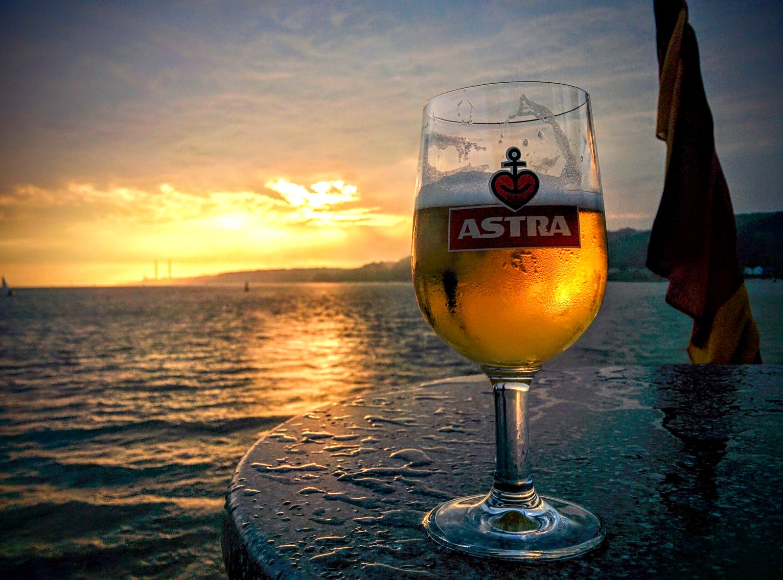 A local Astra beer as the sun goes down
