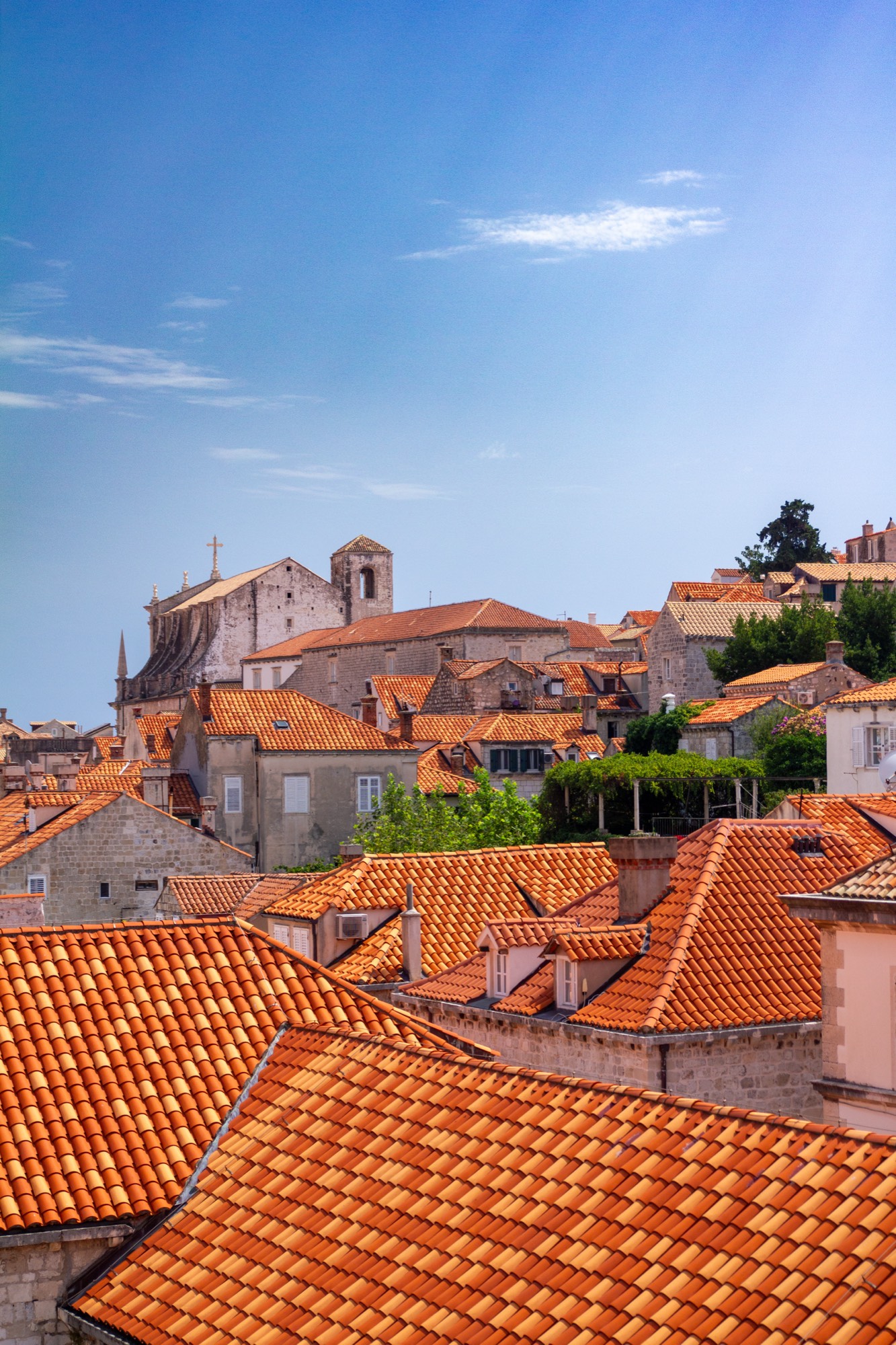 On the city walls, above the red roofs